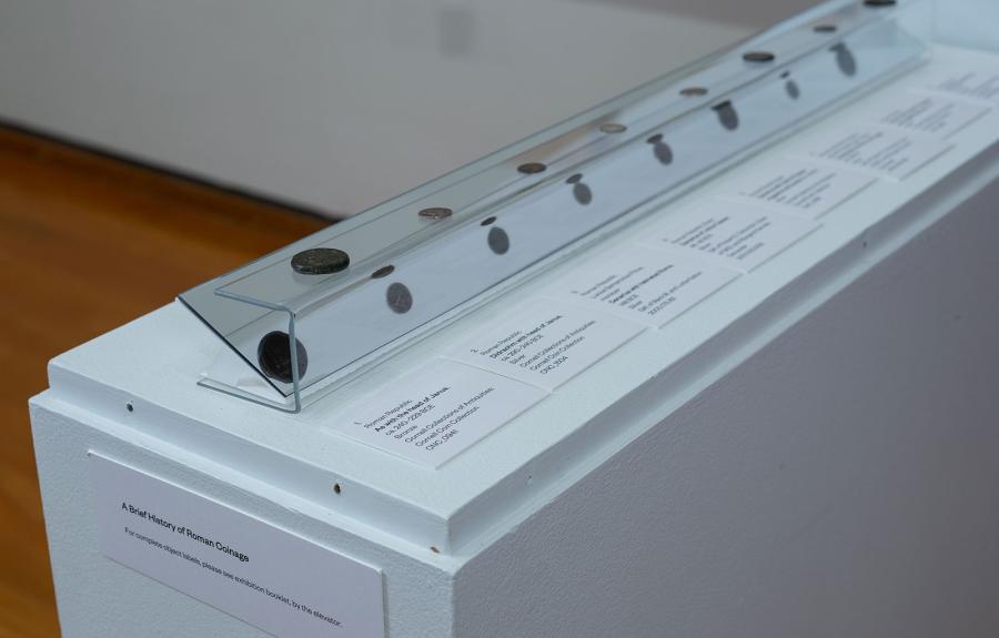 Coins in a museum case