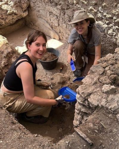 Iris Verbiesen (MA student ) and Professor Barrett excavating in dirt and ancient brick